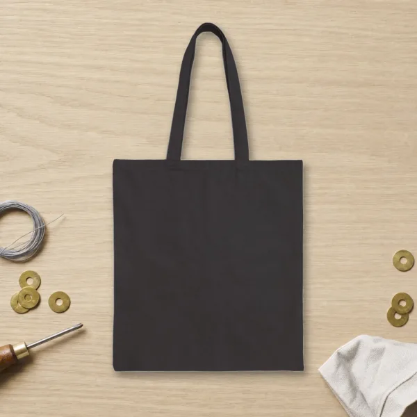 Plain back of the black canvas tote with the Aurora Overhead design, printed on the front only