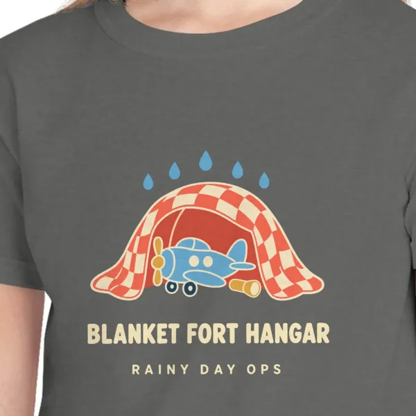 blanket-fort-hangar-kids-tee-pepper-chest Close-up of the Blanket Fort Hangar design on the Pepper kids tee, Comfort Colors 9018 youth tee, with the neckline
