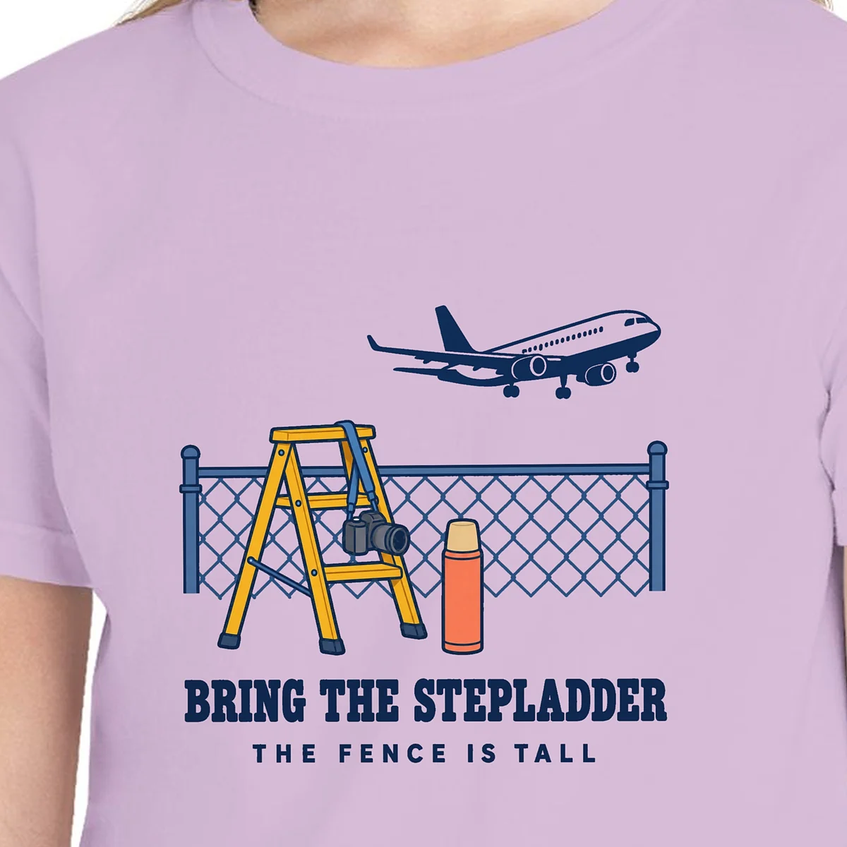 Close-up of the Bring the Stepladder design on the Orchid kids tee, Comfort Colors 9018 youth tee, with the neckline