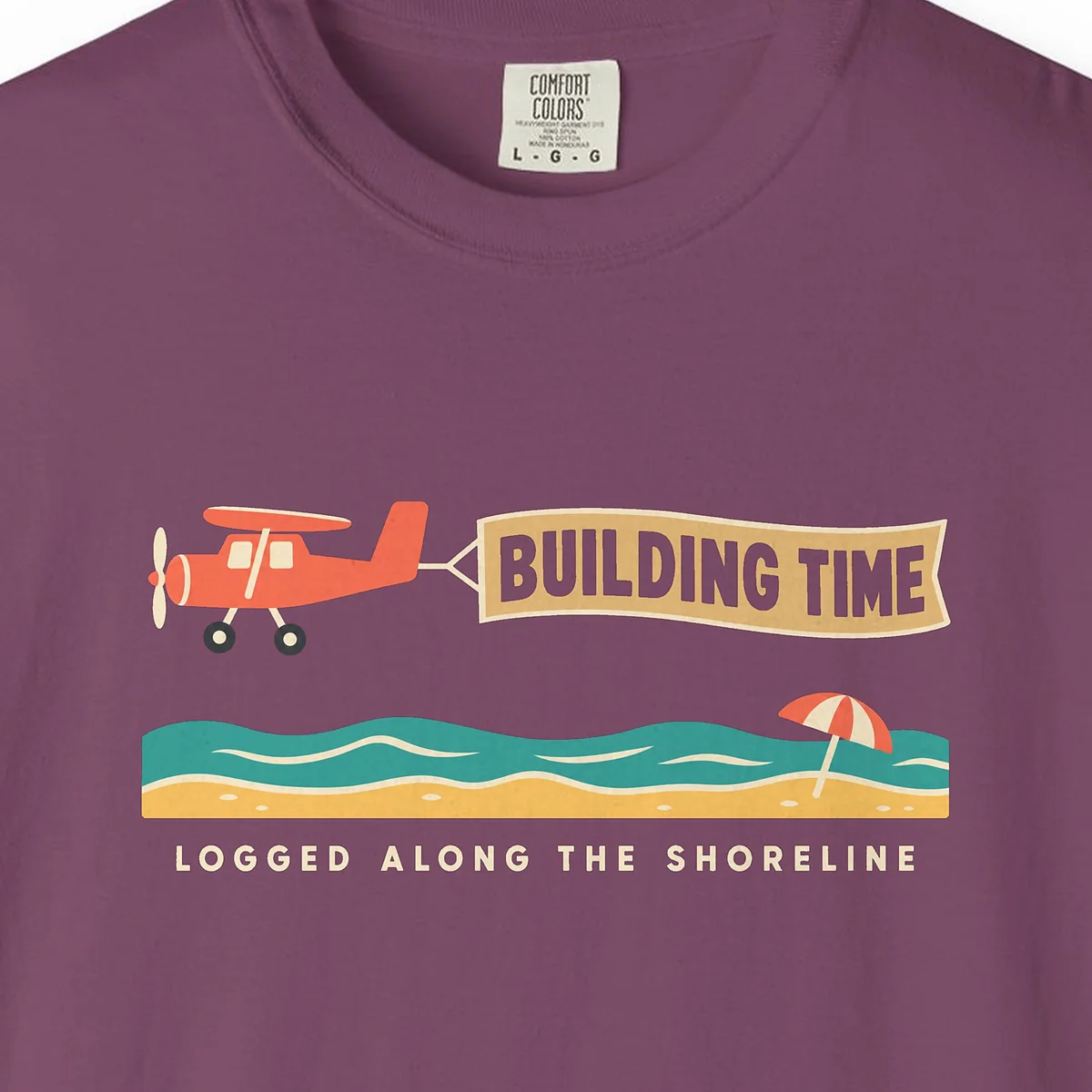 Building Time Tee in Berry, close-up