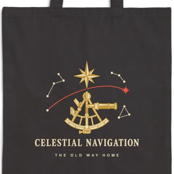 Close-up of the Celestial Navigation design printed in warm cream ink on a black canvas tote, with the top seam and handles