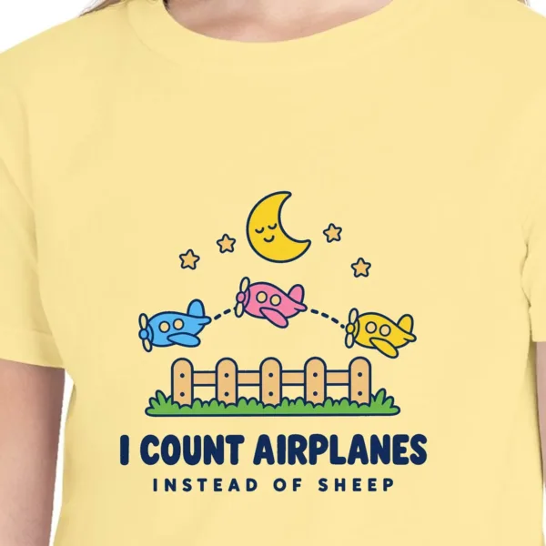 counting-airplanes-kids-tee-butter-chest Close-up of the Counting Airplanes design on the Butter kids tee, Comfort Colors 9018 youth tee, with the neckline