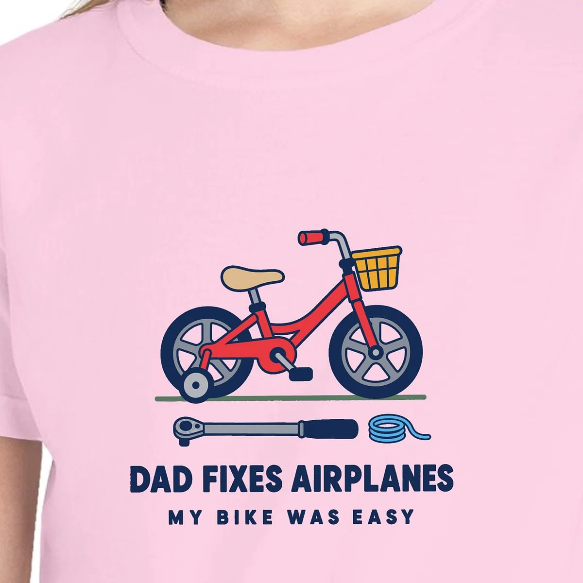 dad-fixes-airplanes-kids-tee-blossom-chest Close-up of the Dad Fixes Airplanes design on the Blossom kids tee, Comfort Colors 9018 youth tee, with the neckline