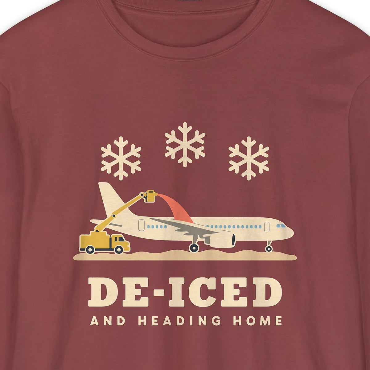 De-Iced and Heading Home design on a Brick Comfort Colors 6014 long-sleeve tee, close-up of the print