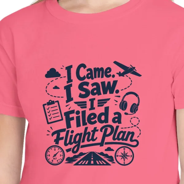 Close-up of the Filed a Flight Plan Script design on the Crunchberry kids tee, Comfort Colors 9018 youth tee, with the neckline