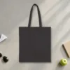 Plain back of the black canvas tote with the Fly-In Farmers Market design, printed on the front only