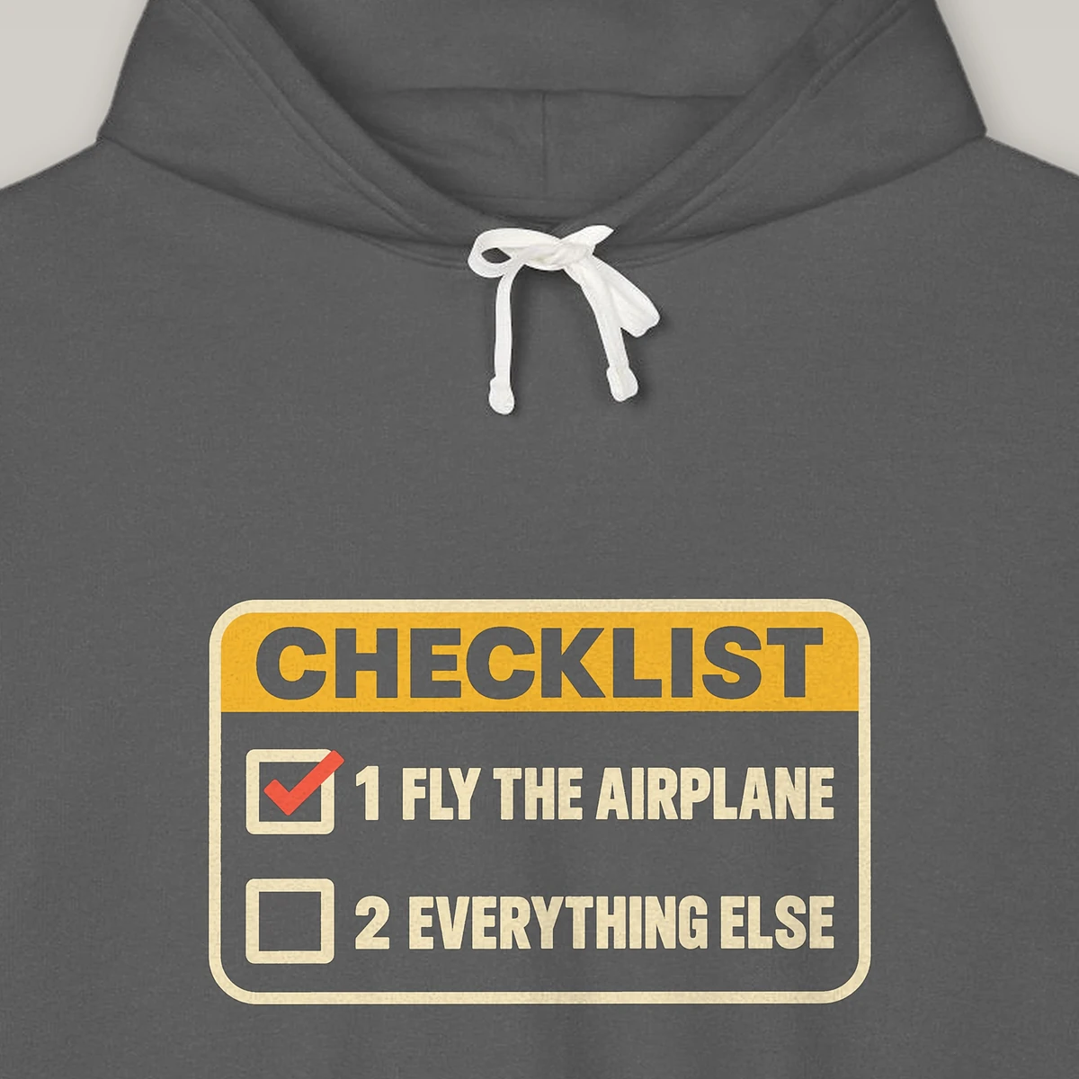 fly-the-airplane-checklist-hoodie-pepper-chest-v1 Fly the Airplane Checklist design on the Comfort Colors 1467 hoodie in Pepper, close-up of the print