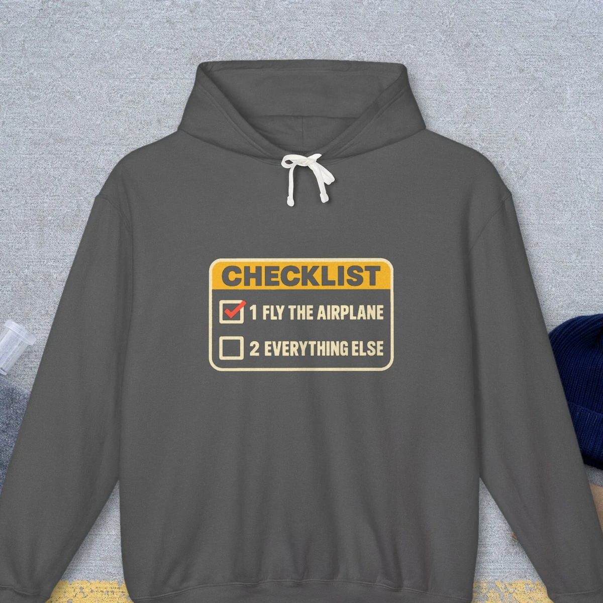 Fly the Airplane Checklist design on the Comfort Colors 1467 hoodie in Pepper, front view