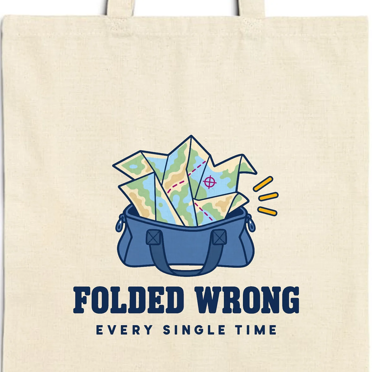 Close-up of the Folded Wrong design printed in navy ink on a natural canvas tote, with the top seam and handles