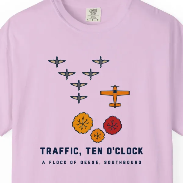 geese-at-ten-oclock-tee-orchid-chest Geese at Ten O'Clock Tee in Orchid, close-up