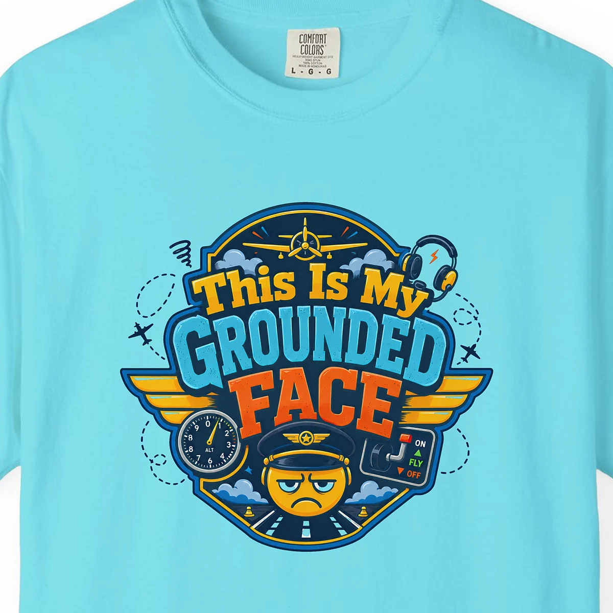 Grounded Face Crest Tee in Lagoon Blue, close-up