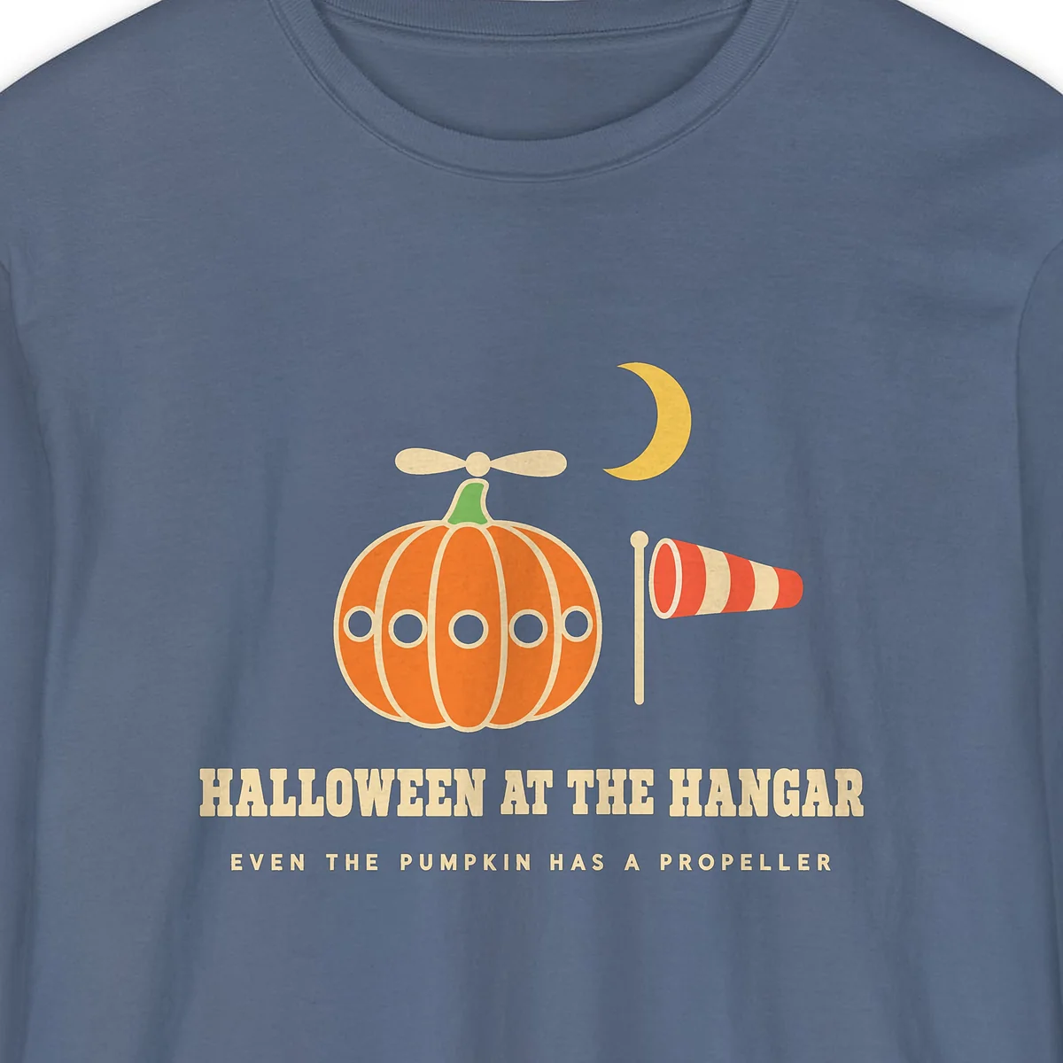 Halloween at the Hangar design on a Blue Jean Comfort Colors 6014 long-sleeve tee, close-up of the print