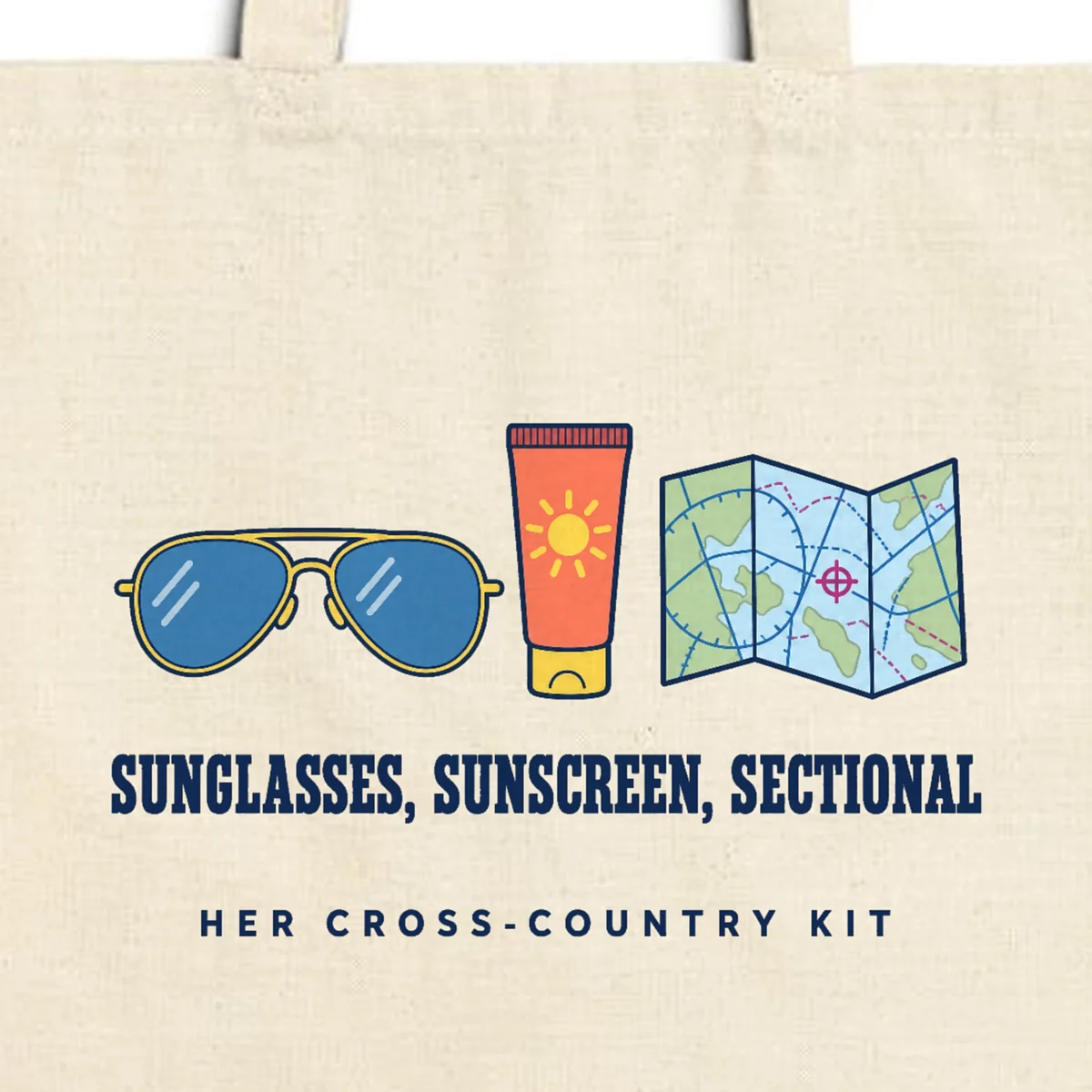 Close-up of the Her Cross-Country Kit design printed in navy ink on a natural canvas tote, with the top seam and handles