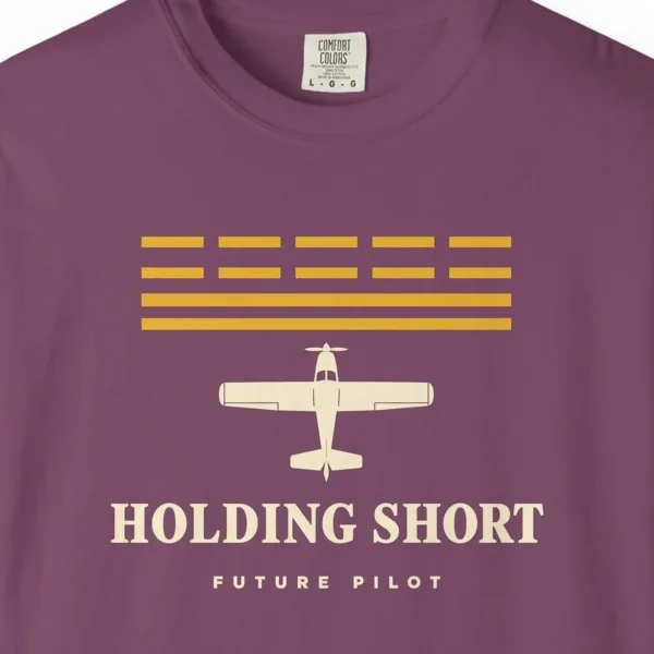Holding Short Tee in Berry, close-up