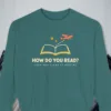 How Do You Read design on a Blue Spruce Comfort Colors 1566 sweatshirt, laid flat on a winter ground
