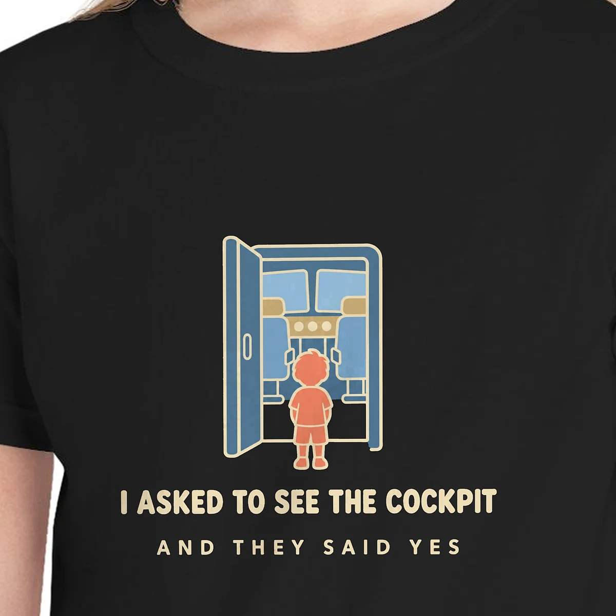 Close-up of the I Asked to See the Cockpit design on the Black kids tee, Comfort Colors 9018 youth tee, with the neckline