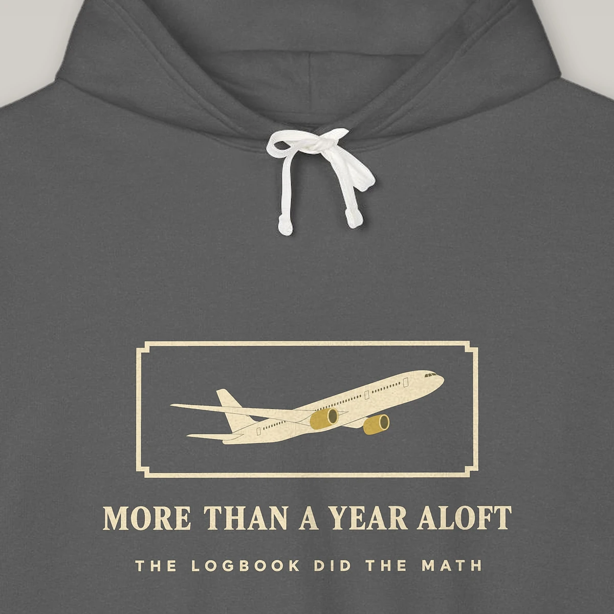 more-than-a-year-aloft-hoodie-pepper-chest-v1 More Than a Year Aloft design on the Comfort Colors 1467 hoodie in Pepper, close-up of the print