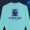 my-night-light-is-the-runway-sweatshirt-chalky-mint-front My Night Light Is the Runway design on a Chalky Mint Comfort Colors 1566 sweatshirt, laid flat on a winter ground