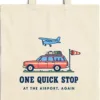 one-quick-stop-tote-natural-detail Close-up of the One Quick Stop design printed in navy ink on a natural canvas tote, with the top seam and handles