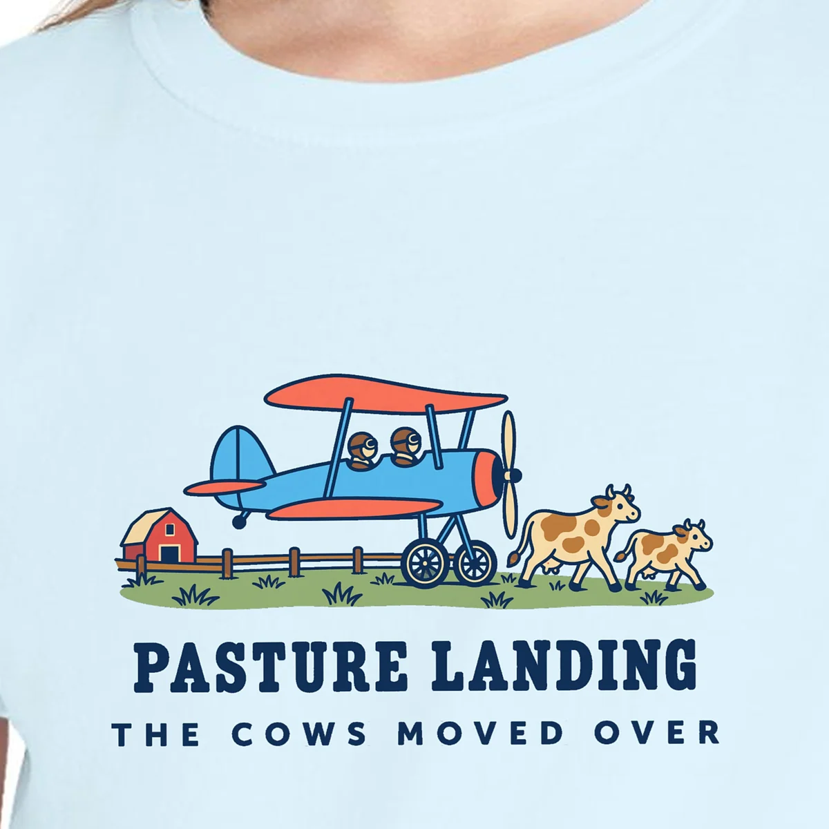 Close-up of the Pasture Landing design on the Chambray kids tee, Comfort Colors 9018 youth tee, with the neckline