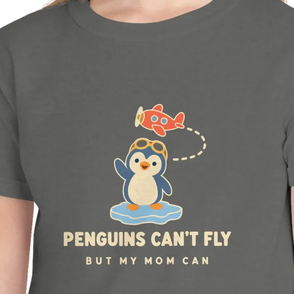 penguins-cant-fly-kids-tee-pepper-chest Close-up of the Penguins Can't Fly design on the Pepper kids tee, Comfort Colors 9018 youth tee, with the neckline