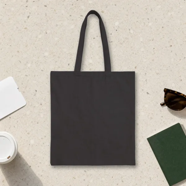 Plain back of the black canvas tote with the Planes by Day design, printed on the front only