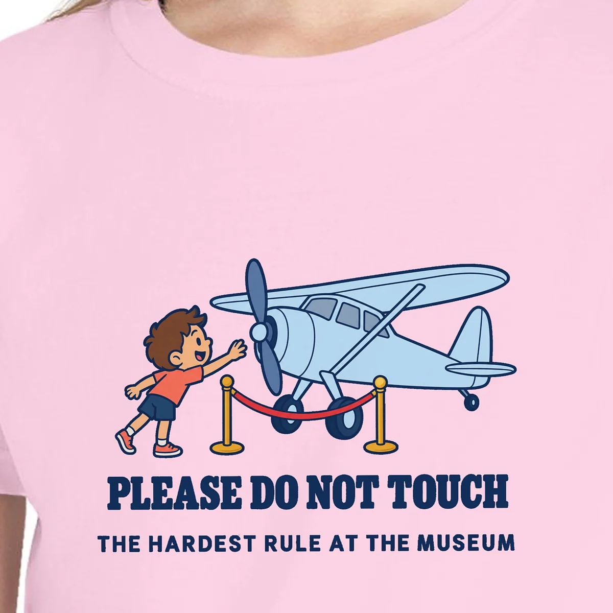 Close-up of the Please Do Not Touch design on the Blossom kids tee, Comfort Colors 9018 youth tee, with the neckline