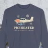 Preheated design on a Denim Comfort Colors 1566 sweatshirt, laid flat on a winter ground