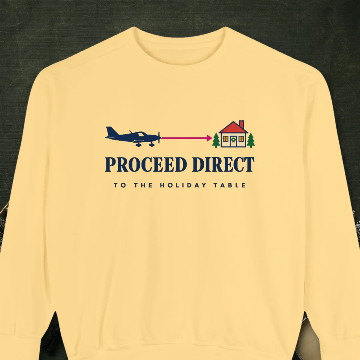 Proceed Direct design on a Butter Comfort Colors 1566 sweatshirt, laid flat on a winter ground