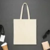 rolled-not-folded-tote-natural-back Plain back of the natural canvas tote with the Rolled Not Folded design, printed on the front only