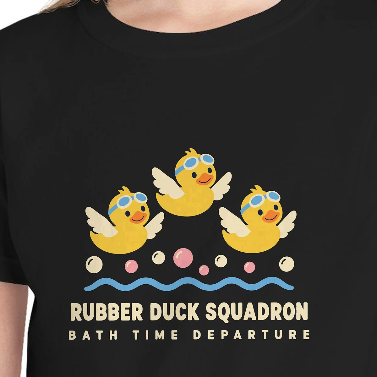 Close-up of the Rubber Duck Squadron design on the Black kids tee, Comfort Colors 9018 youth tee, with the neckline