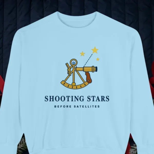 shooting-stars-sweatshirt-chambray-front Shooting Stars design on a Chambray Comfort Colors 1566 sweatshirt, laid flat on a winter ground