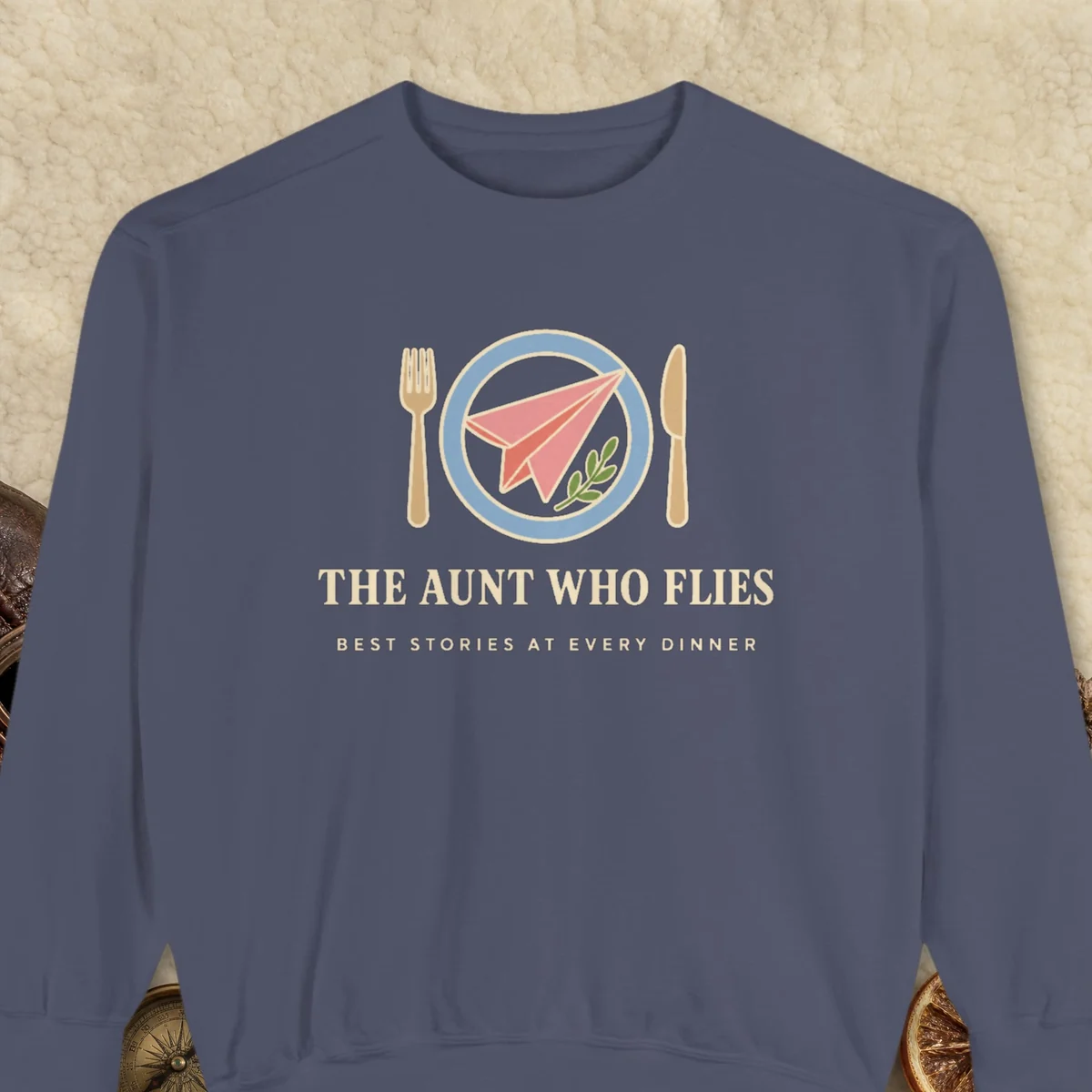The Aunt Who Flies design on a Denim Comfort Colors 1566 sweatshirt, laid flat on a winter ground