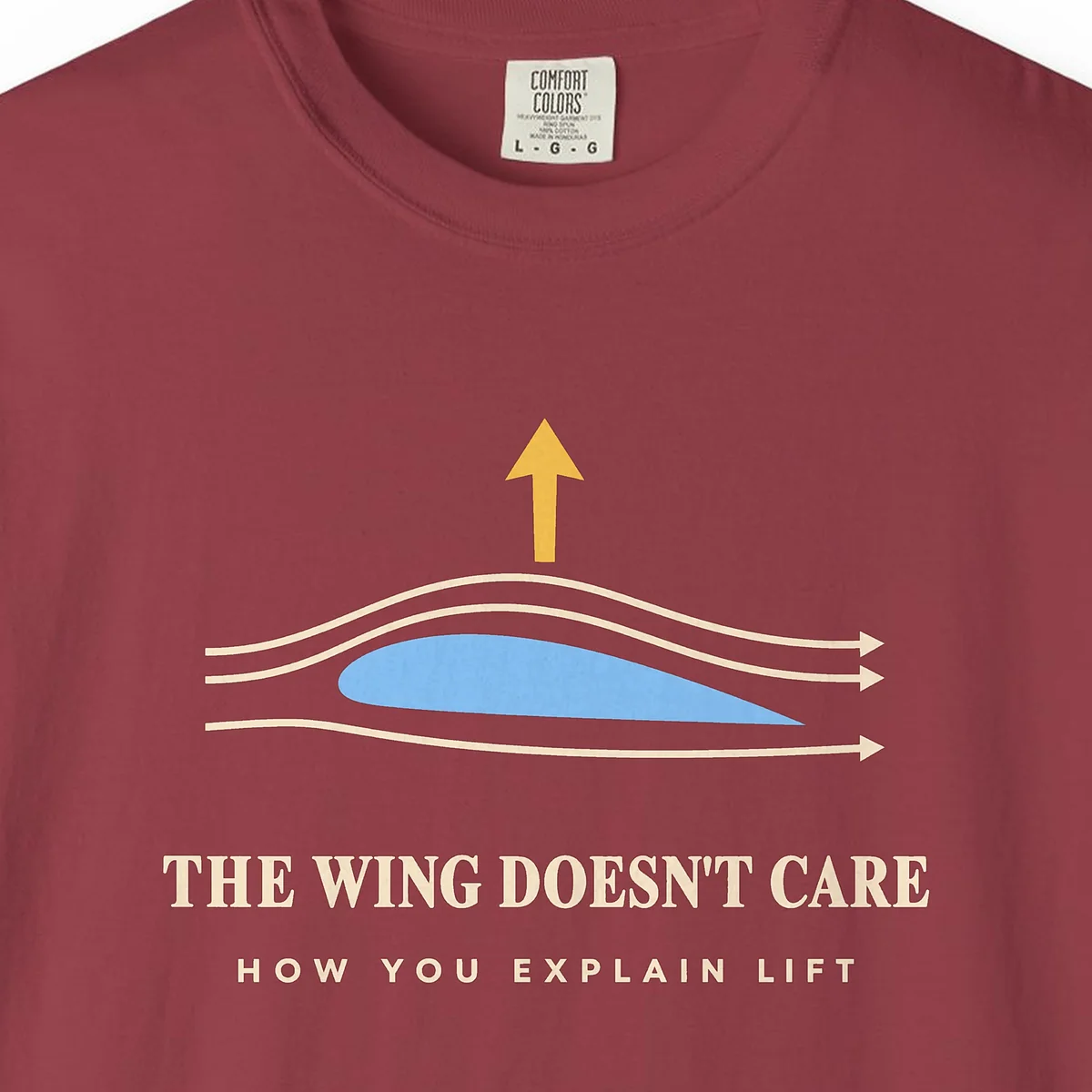the-wing-doesnt-care-tee-chili-chest The Wing Doesn't Care Tee in Chili, close-up