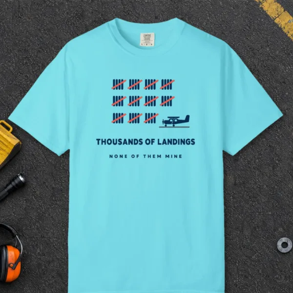 thousands-of-landings-tee-lagoon-blue-front Thousands of Landings Tee in Lagoon Blue, front view
