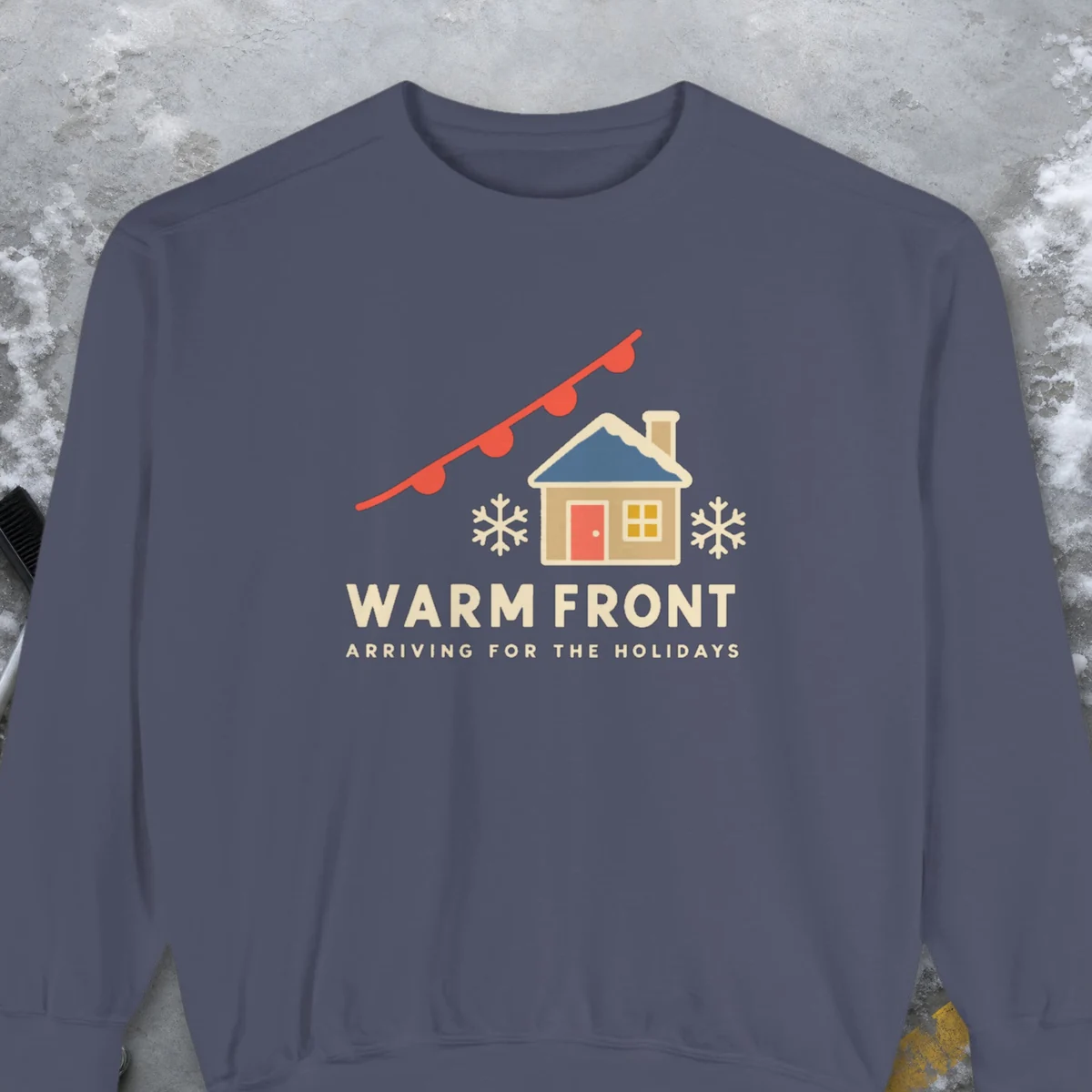 Warm Front Holiday design on a Denim Comfort Colors 1566 sweatshirt, laid flat on a winter ground