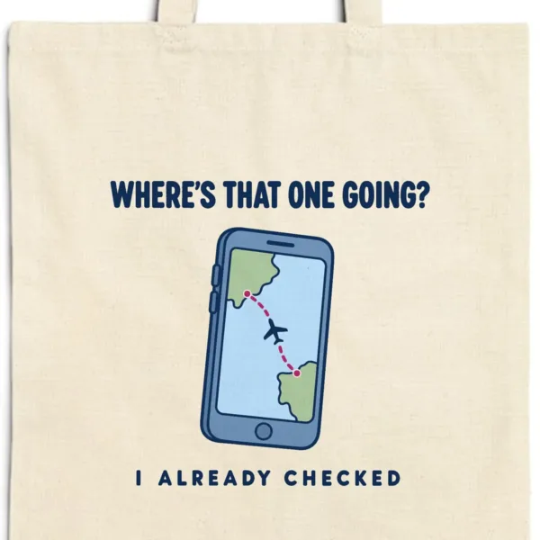 wheres-that-one-going-tote-natural-detail Close-up of the Where's That One Going design printed in navy ink on a natural canvas tote, with the top seam and handles